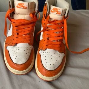 Orange Nike high top shoes